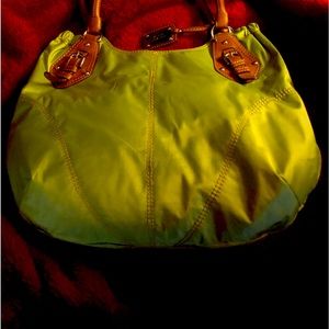 Lime green bag…waterproof inside & out..zipper pocket inside plus open pockets